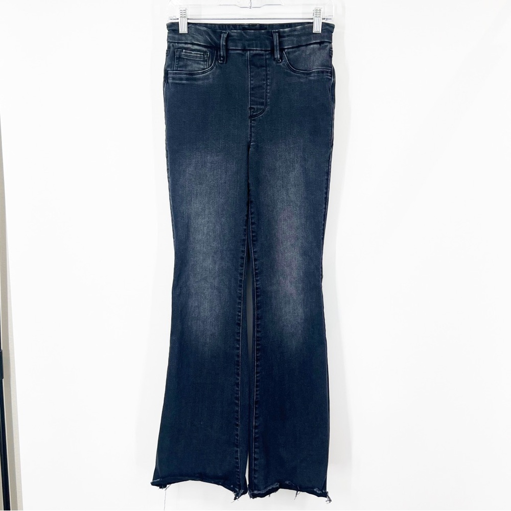 Good American Pull-On Flare Jeans in Washed Black255 High Rise Raw Hem